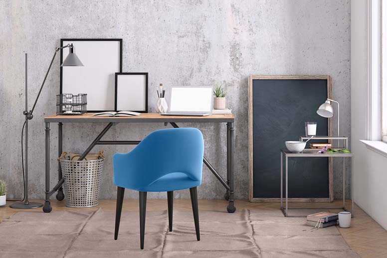 Sininen nojatuoli ja työpöytä