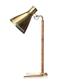 Bukowskisin Tukholman huutokaupassa myytiin tämä Paavo Tynellin suunnittelema ja Taito Oy:n 1900-luvun puolivälissä valmistama pöytävalaisin noin 7 000 eurolla. Valaisin on kiillotettua messinkiä ja korkeudeltaan 52 cm. Siinä on vähäisiä käytön jälkiä. Kuva Bukowskis