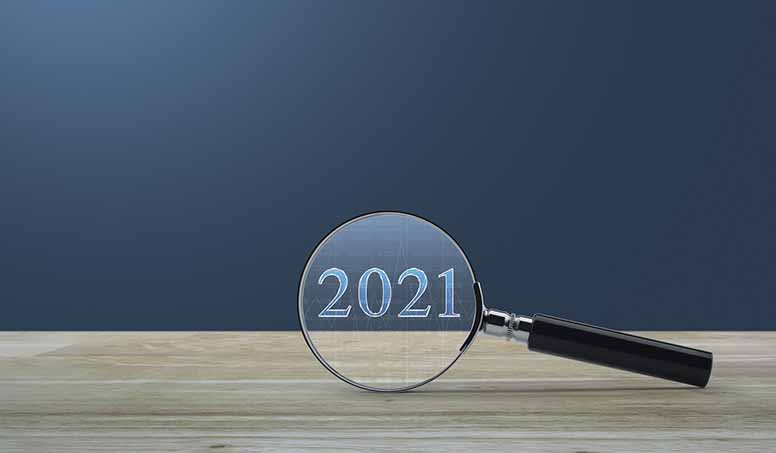 Suurennuslasi ja vuosiluku 2021