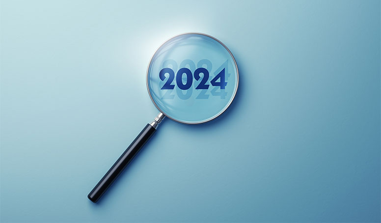 Suurennuslasi ja vuosiluku 2024